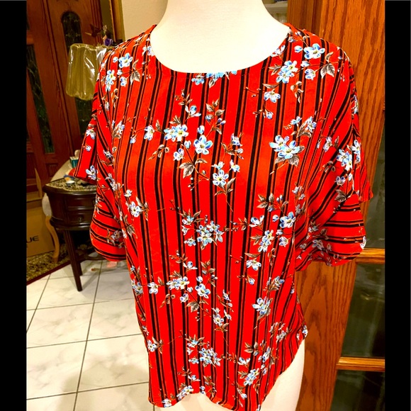 Blouse in Orange navy and light blue sbd white floral by ÁGAGI - Picture 1 of 8